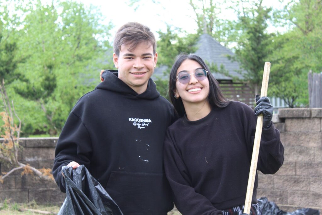 IMG_5122 | Citizens Options Unlimited Two Camp Loyaltown counselors with a shovel anda garbage bag for cleaning up the camp.