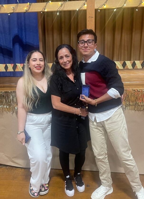 Three Camp Loyaltown staff members pose for a photo at Staff Appreciation Night.